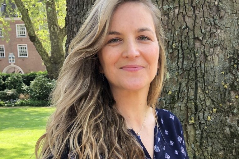 Josefina beside a tree