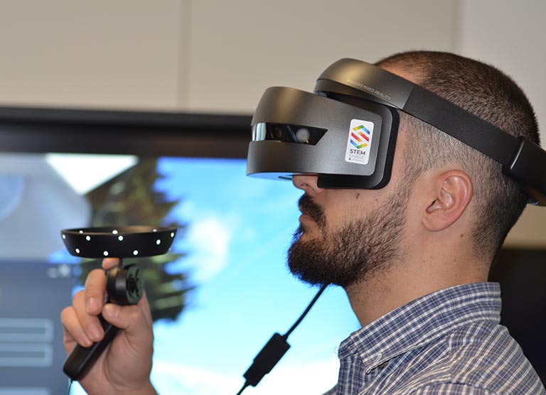 Metaverse for eLearning Man using VR headset and control stick for elearning