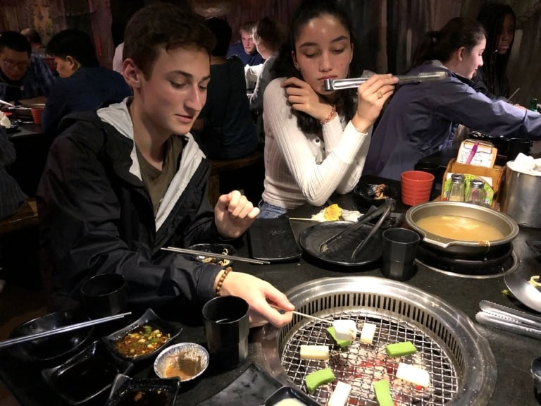 Two participants eat hotpot dinner in Taiwan