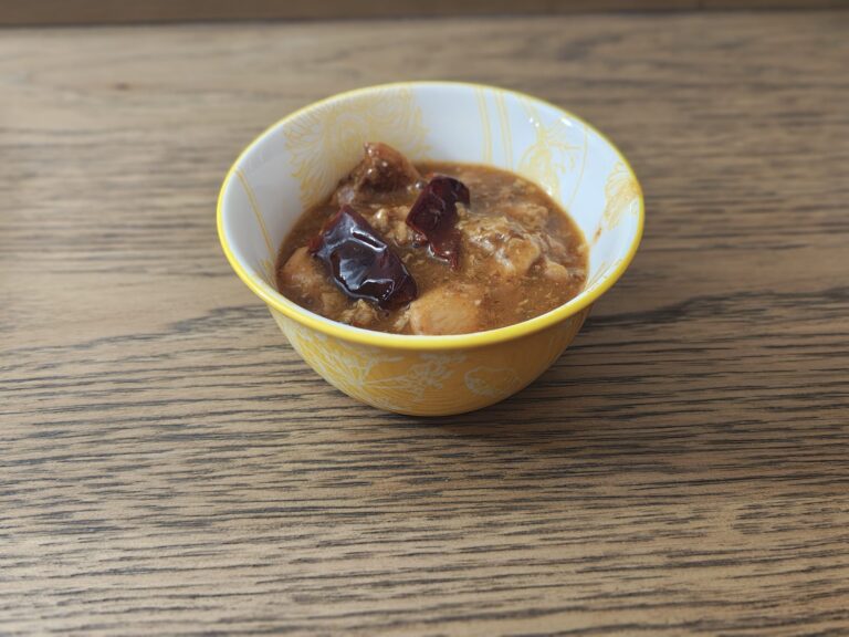 Scezzhwan chicken in yellow bowl