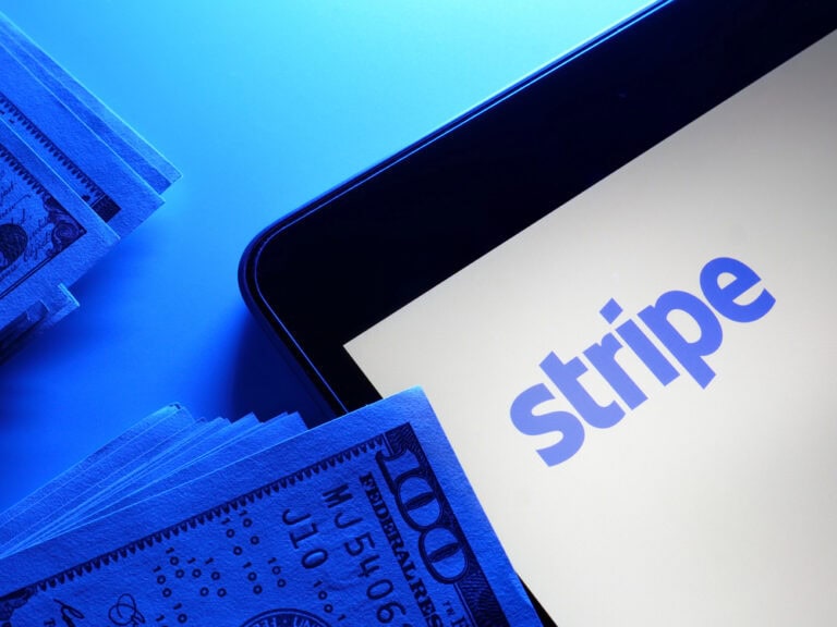 "Stripe" on a digital screen with money and checks