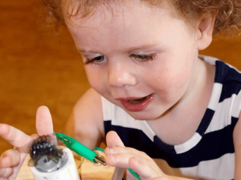 Pittsburgh children's museum Little girl using a STEM play exhibit