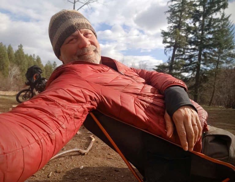 motorcycle camper sitting in camp chair