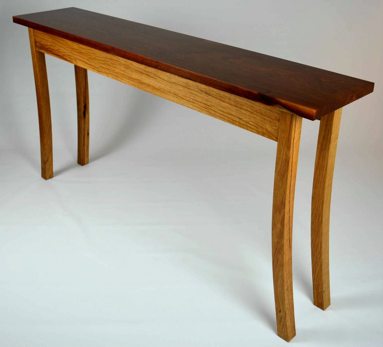 Custom made timber furniture. Custom made furniture and furniture maker. Yellow box hall table. With clean lines and curved legs creates an elegant and dynamic piece. Customization options can include draws in the front or adjust the proportions to made a writing desk or console table.