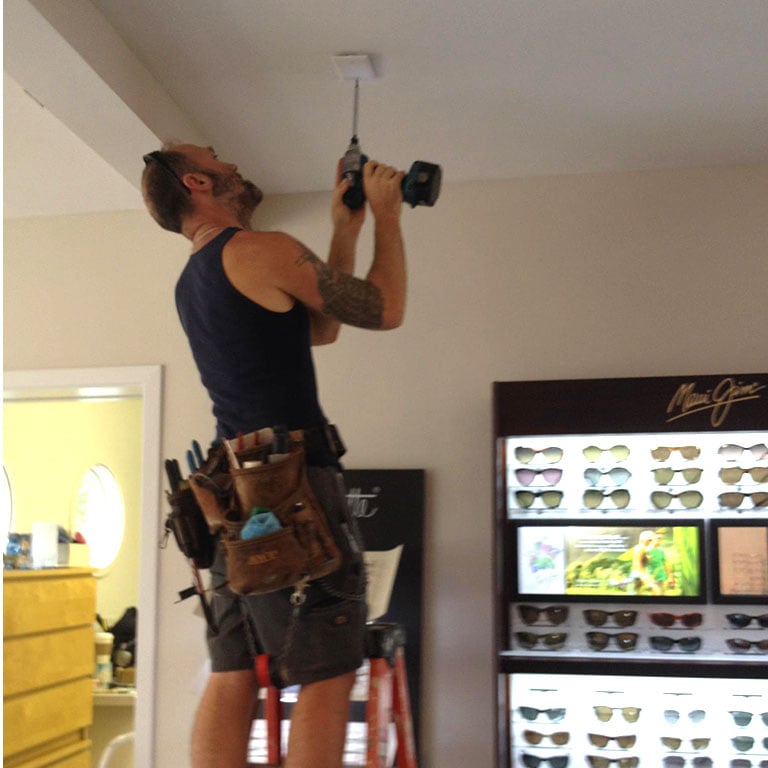 Brad Bonneville installing ceiling fixture – Professional electrical service in Chapel Hill, NC