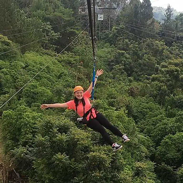 Tourists zip-lining over the forest canopy at Eden Nature Park in Davao City.