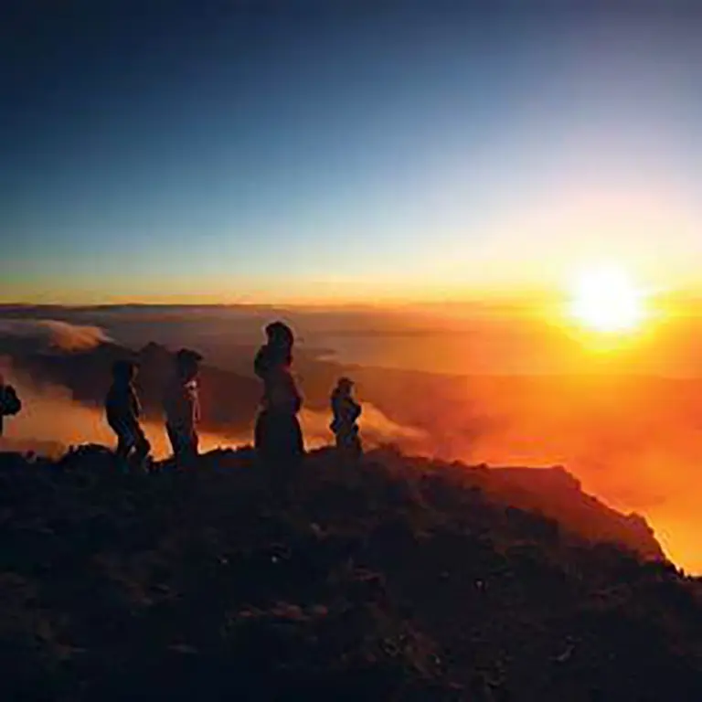 A group visitors to Mt Apo experiencing the morning sunrise and the amazing view.