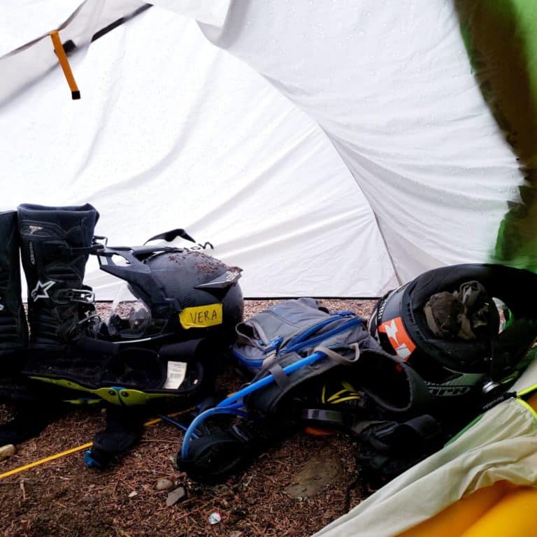 motorcycle gear in vestibule of camping tent
