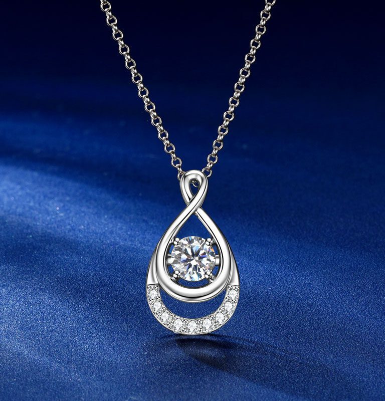 Front view of the GLAMAVERA Elyenne Pendant 1CT moissanite infinity necklace in silver on a blue background