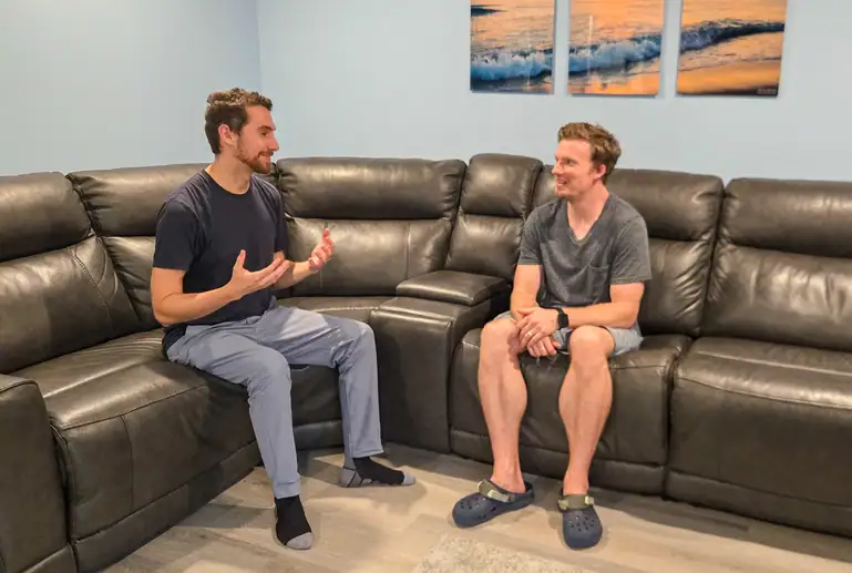 Brendan Marshall RP(Q) sitting on his markham office couch speaking with his male client with Anxiety and ADHD
