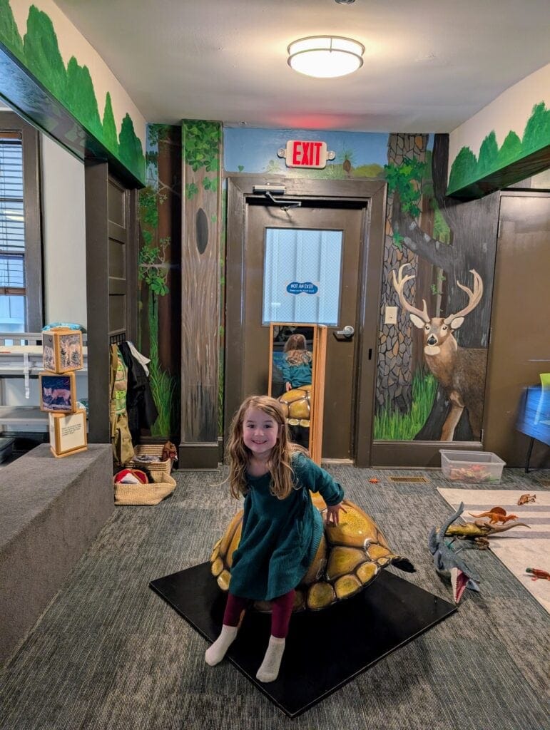 River playing in the nature exhibit at A Time for Science in Greenville, NC.