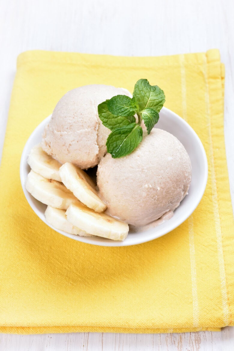Vanilla Banana Ice Cream Decorated With Slices In Bowl