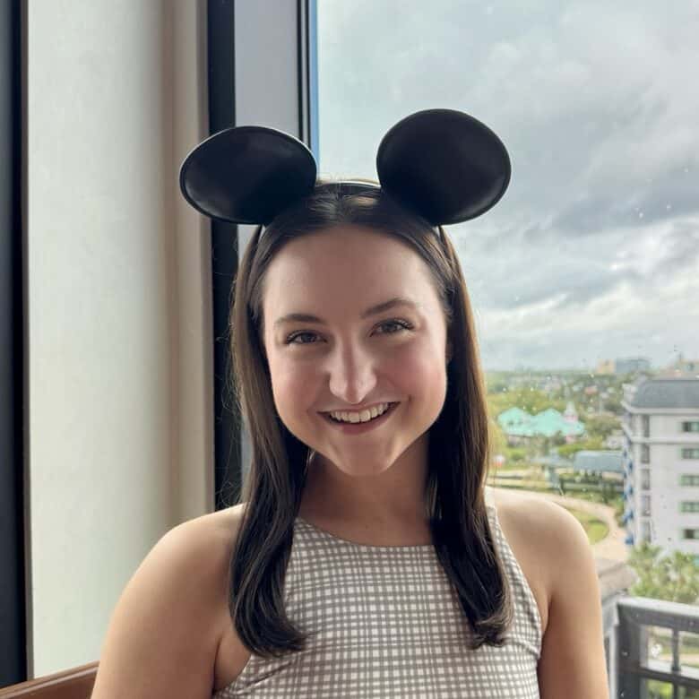 Mickey Mouse ears headband at a vacation property, young woman enjoying her stay in Orlando, Florida.