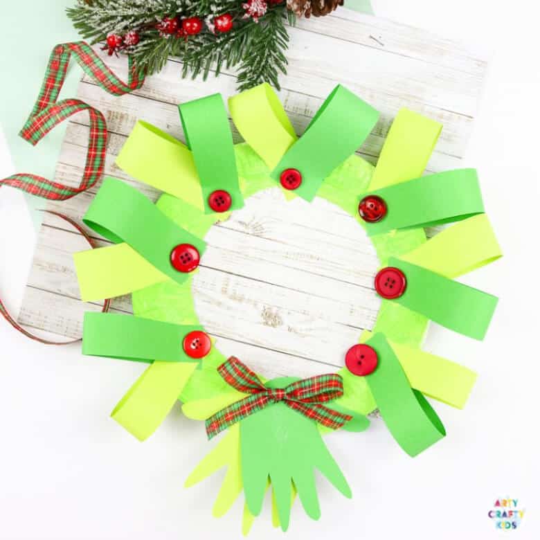 paper plate handprint Christmas wreath in green shades, for kids craft ideas