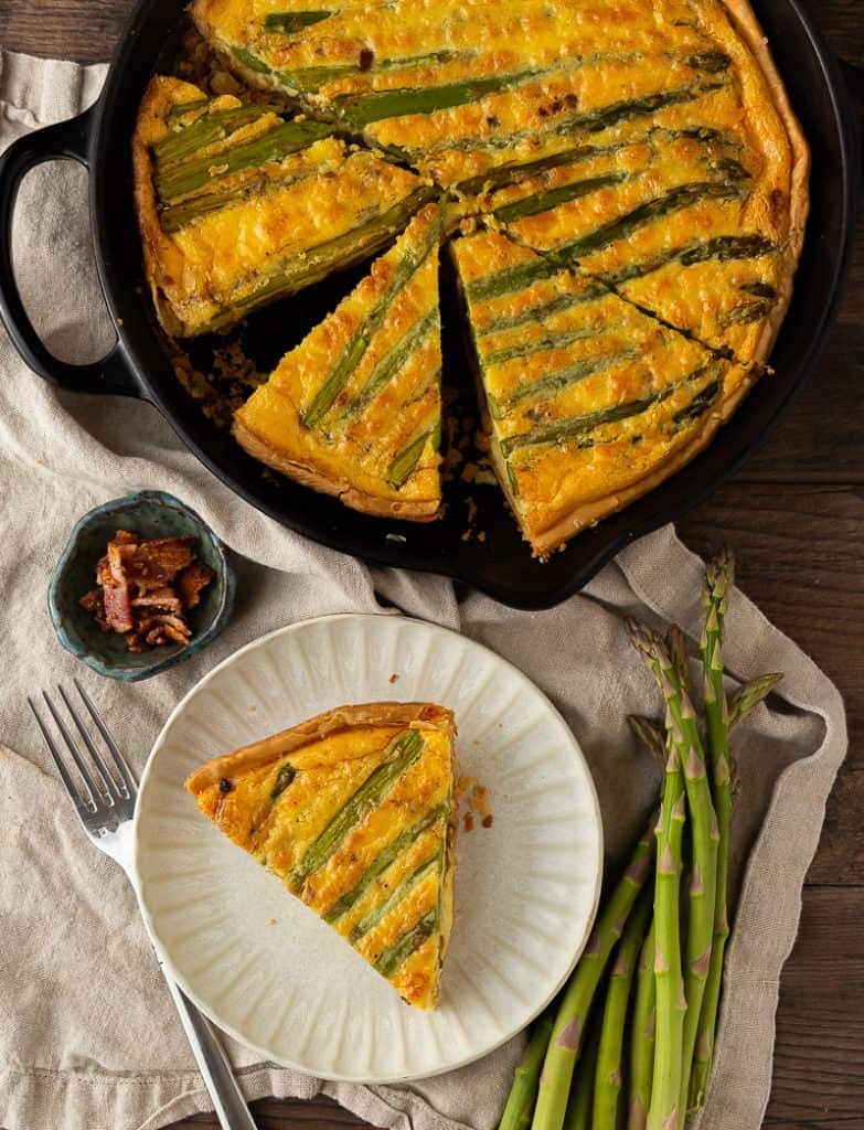 Slice of asparagus and bacon quiche