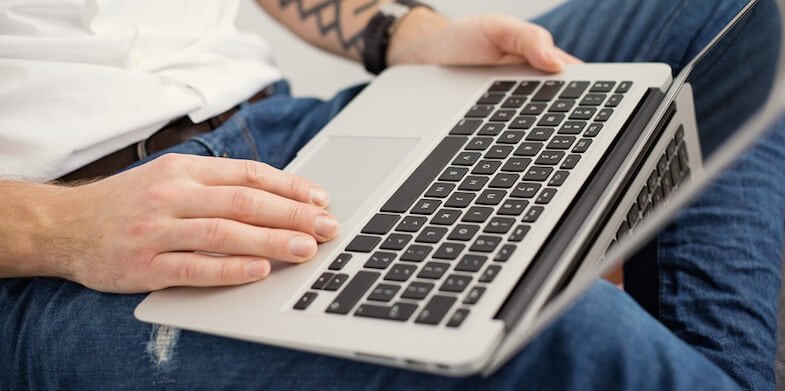 Young man with laptop computer