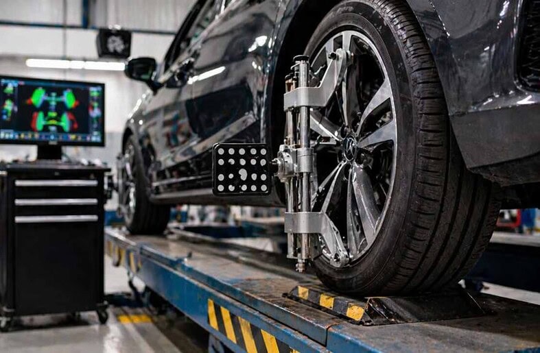 Car wheel alignment setup in auto repair workshop