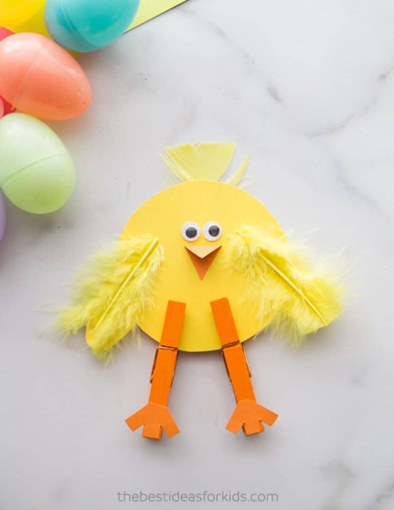 chick made with paper, clothespins, and feathers