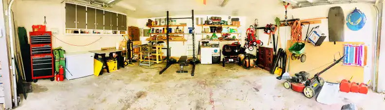 Organized garage workshop with tools, shelves, and storage solutions for home improvement projects.