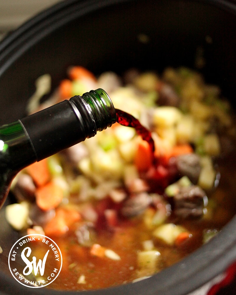 Adding red wine to the Slow Cooker Sausage Stew