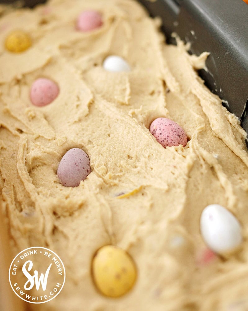 mini eggs studding the top of the mini egg cookie traybake