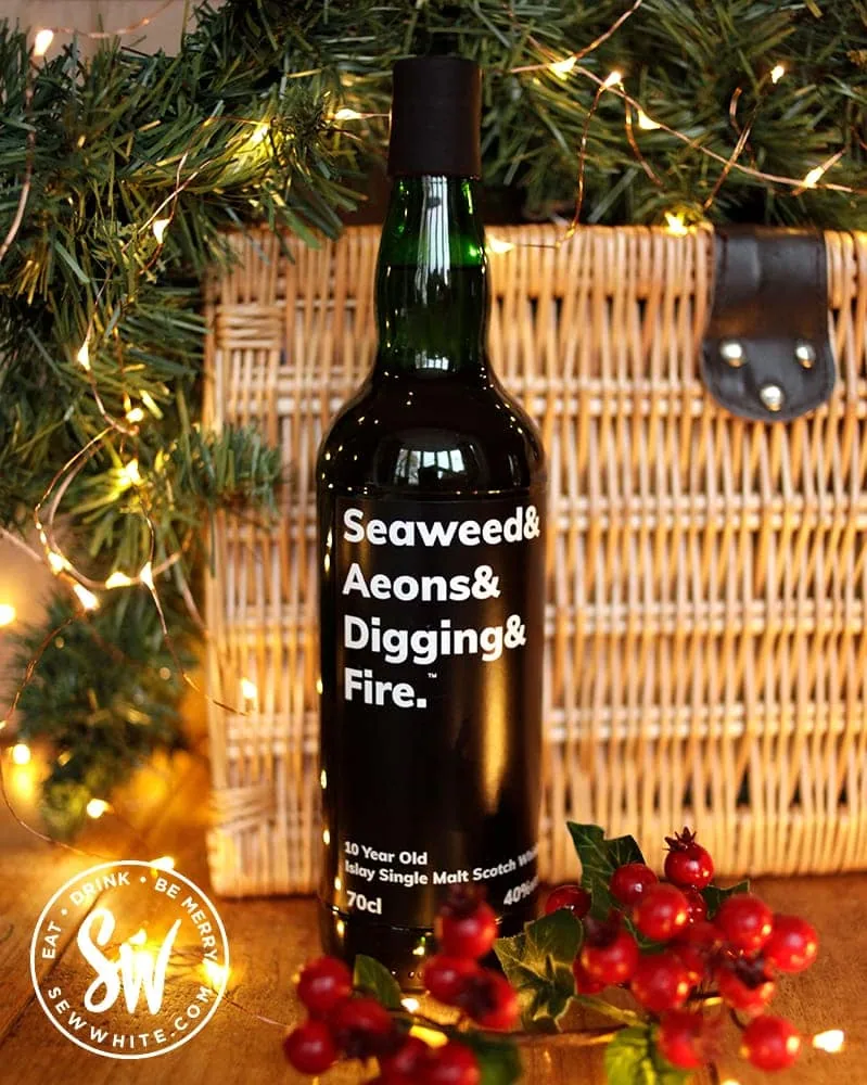 Seaweed & Aeons & Digging & Fire in a wicker basket for a Christmas gift basket. Drink gift guide