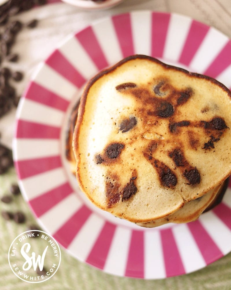 Top view of a stack of pancakes with chocolate and cherry pieces. Easy black forest pancake recipe