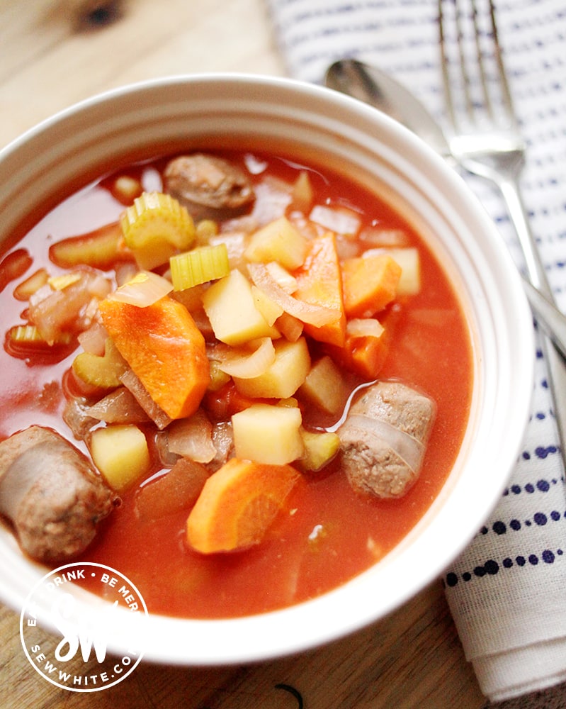 Ready to serve Slow Cooker Sausage Stew with napkin and cutlery