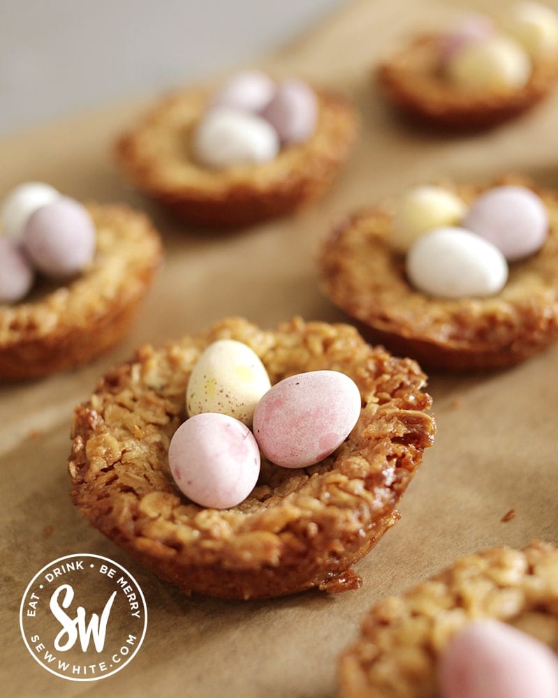 Gold brown soft flapjack recipe  with pastel Easter chocolate eggs