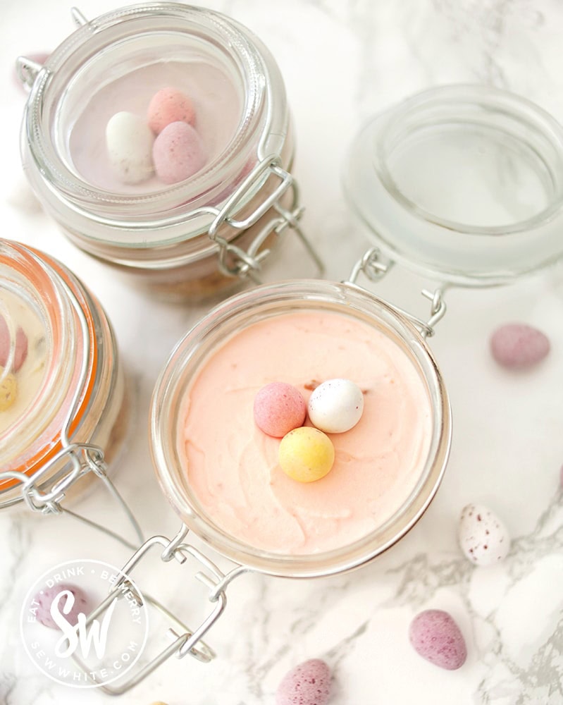 open clip lock jar with mini cheesecakes for easter with mini eggs