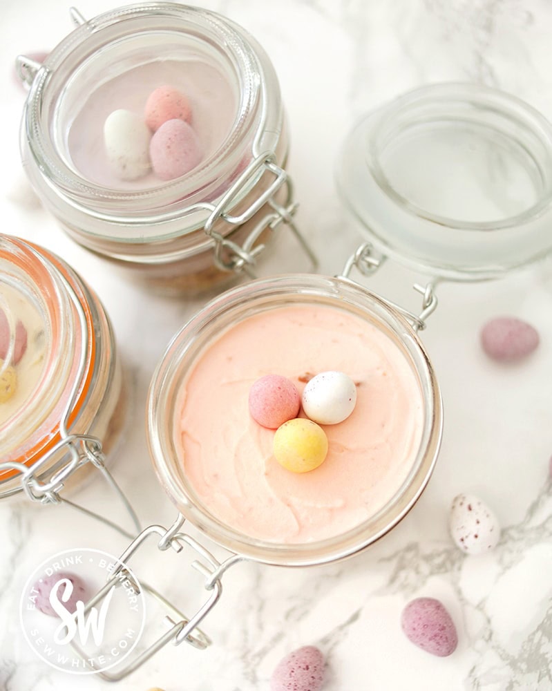 open clip lock jar with mini cheesecakes for easter with mini eggs 