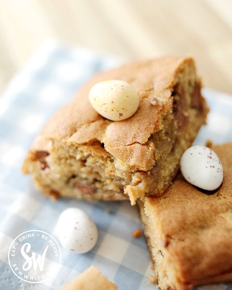 Close up of the squidgy cookie traybake for Easter with chocolate eggs - mini egg cookie bars