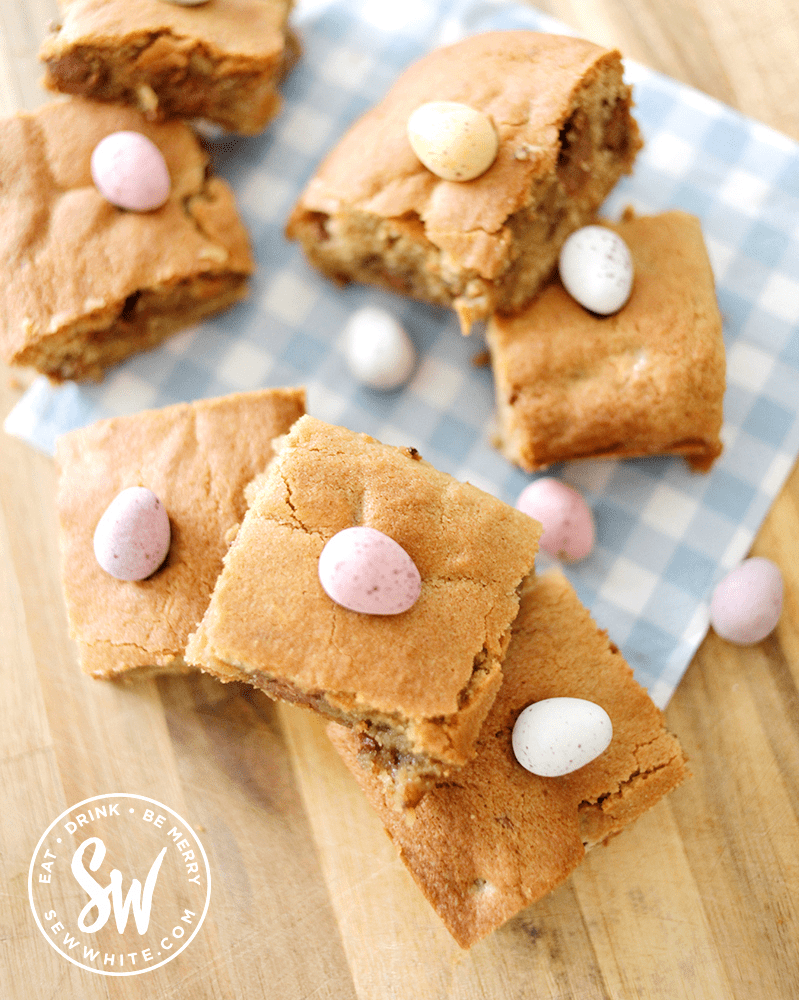 mini egg cookie bars traybake for easter. Chocolate easter eggs in a chunky cookie