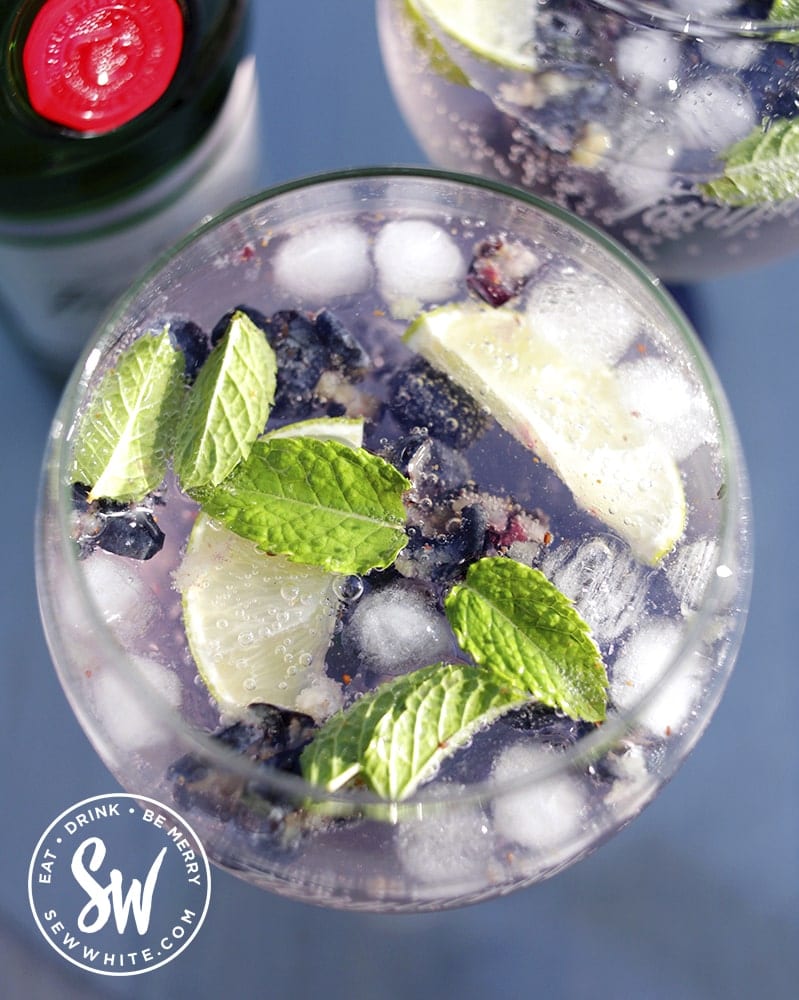 a top view of the blueberries, mint and lime for the  Blueberry Gin and Tonic Recipe