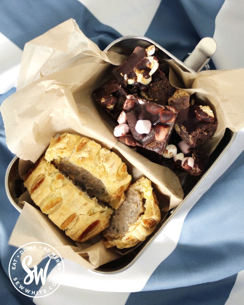 best picnic accessories - wakecup metal lunchbox with divider and sausage roll and rocky road