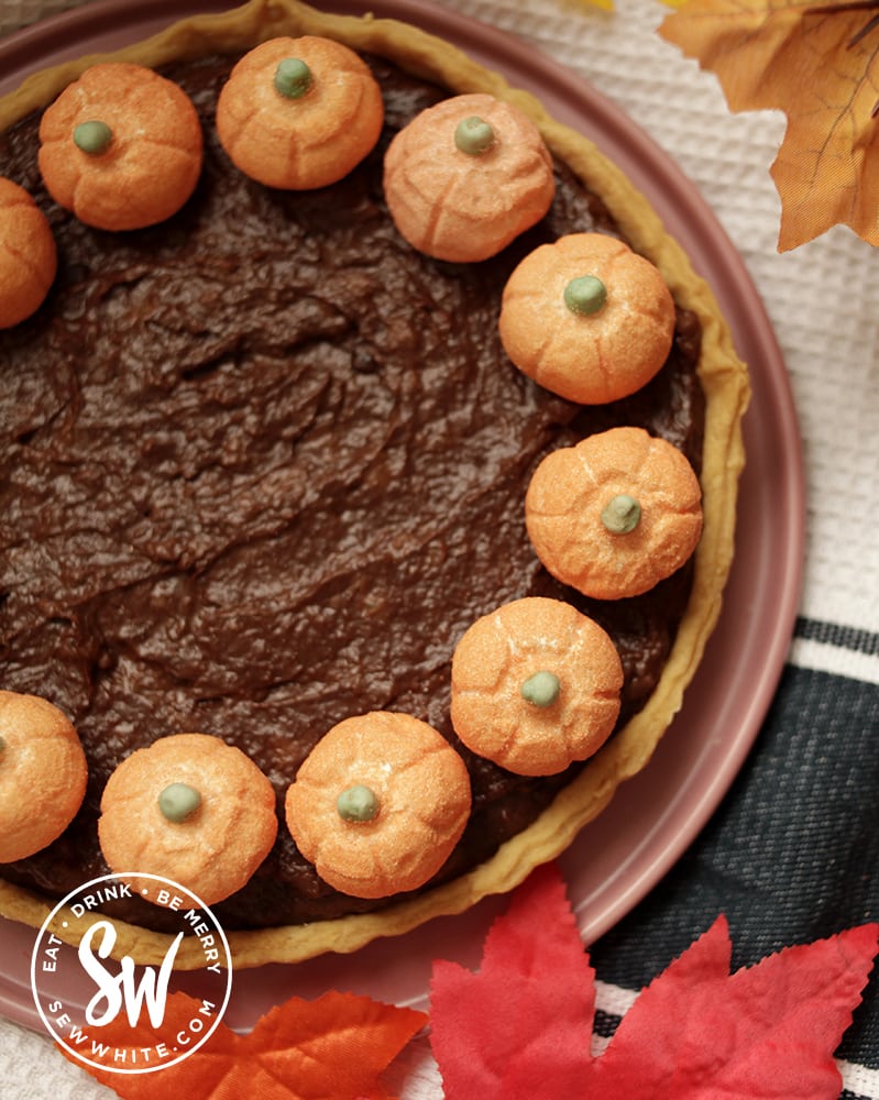 chocolate pumpkin tart dotted with marshmallow pumpkin candy