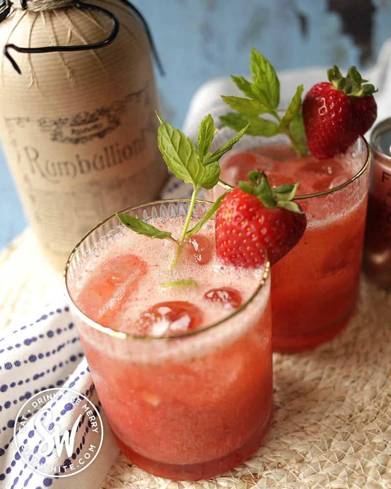 Close up of the strawberry rum cocktail with fresh mint and strawberries