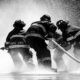 grayscale photo of firemen