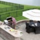 Man cooking meat on a gas BBQ