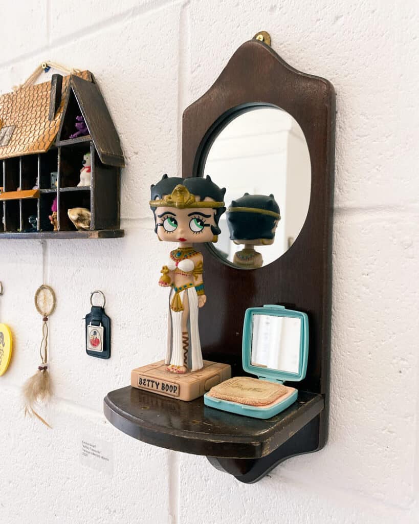 Betty Boop figurine and vintage compact displayed in Emma Sielaff’s curated object-based art show.