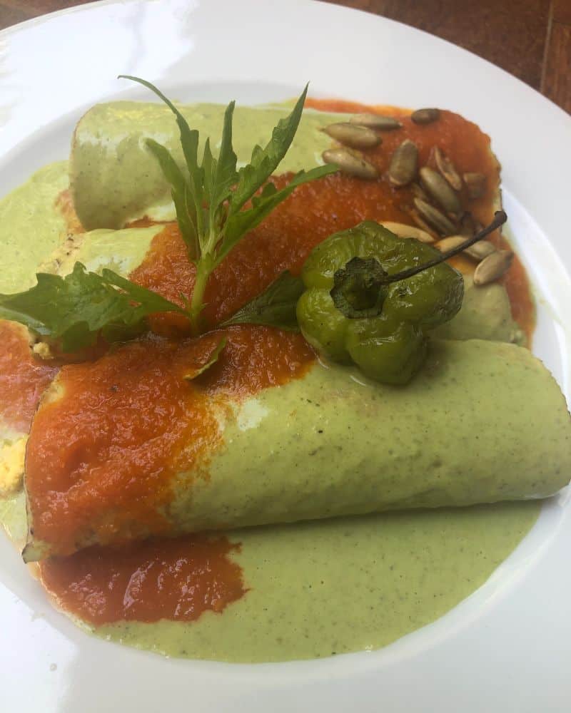 plate of green mole enchiladas