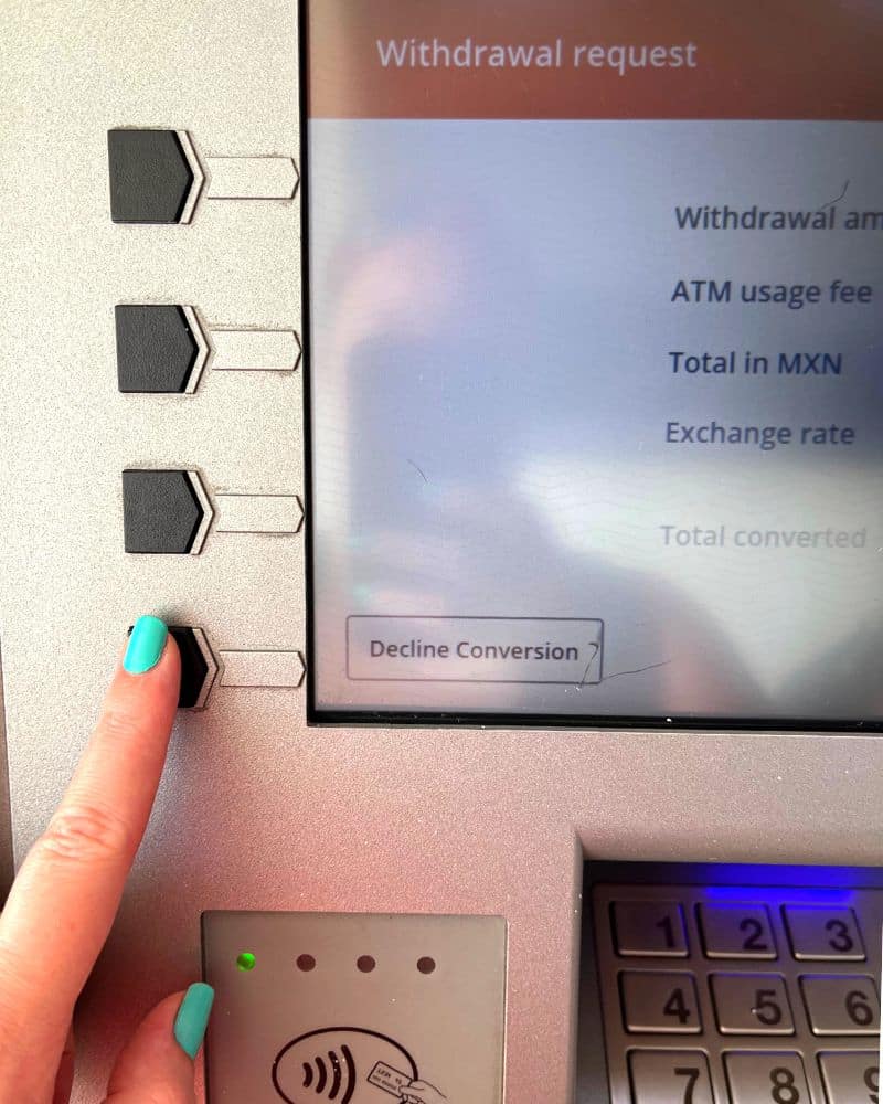 woman using the ATM in oaxaca mexico
