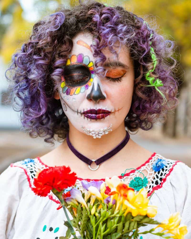 woman with her face painted like La Catrina for Oaxaca Day of the Dead