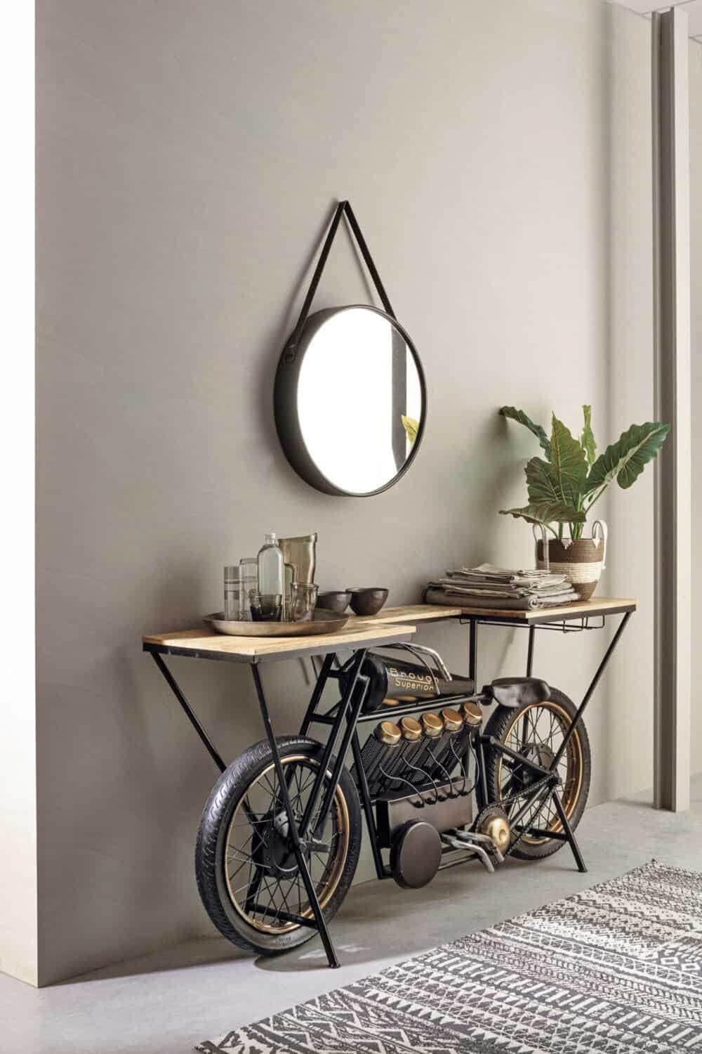 Specchio rotondo luminoso con supporto in pelle, design minimalista e funzionale.