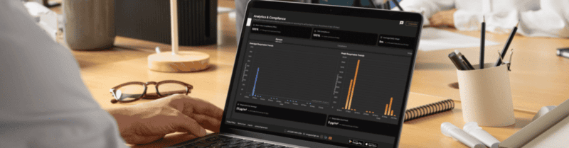 HSE manager analyzes dust exposure and compliance trends in the Dustlight web app on a laptop.