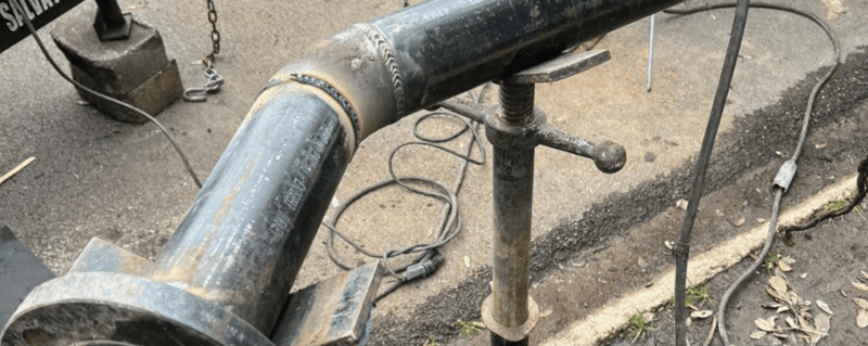 Miller Pipe Pro 400 welding stainless steel pipes on industrial job site