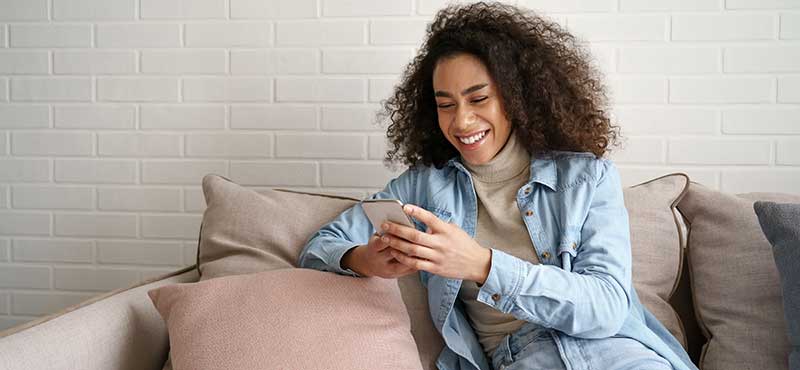 wink and wave woman booking rmt massage on phone