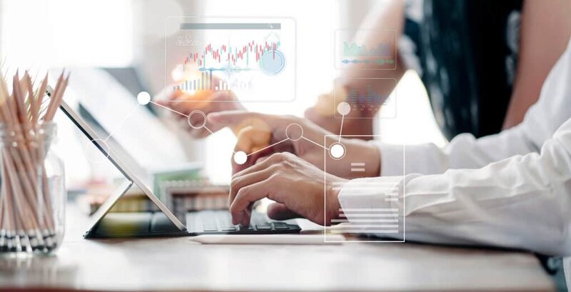 Boss and employee reviewing grants with grant management software