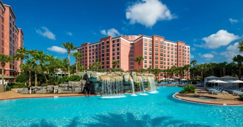 Best Western Caribe Royale Orlando hotel pool and fountain with main building in background. Used as featured image for Best Western Rewards special offers.