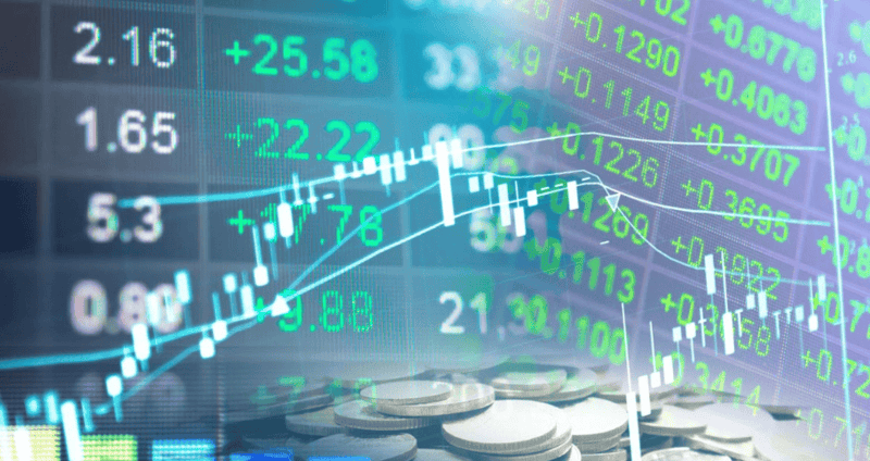 Financial market data with stock charts and coins for investment insights.